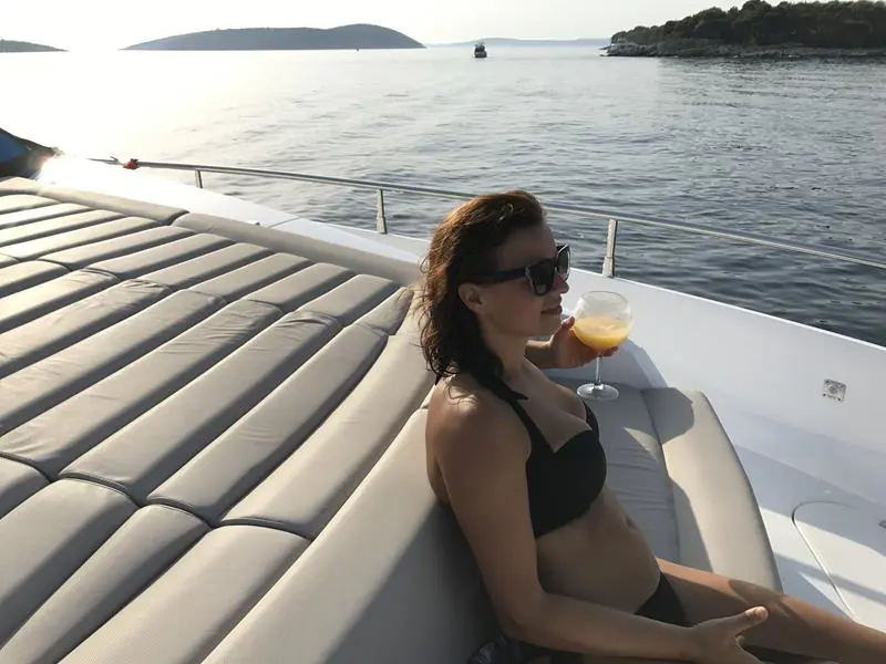 Guest enjoying a beverage aboard Mowana Yacht
